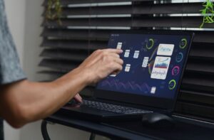 Recruiting team reviewing technology tools and dashboards to improve hiring efficiency.