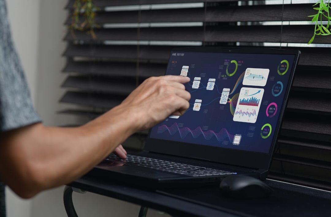 Recruiting team reviewing technology tools and dashboards to improve hiring efficiency.