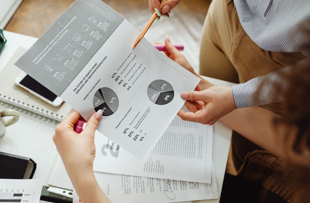 Business leaders reviewing recruiting model comparisons to choose the most effective partnership.