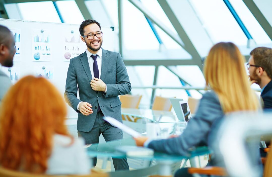 Executive team reviewing hiring priorities and deciding between contract and retained search models.