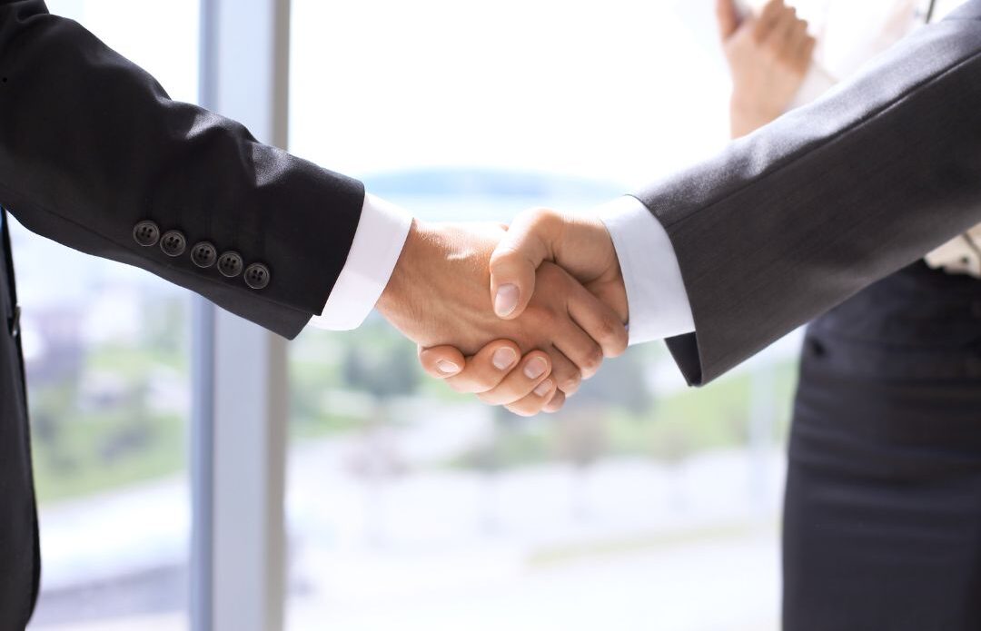 Recruiting consultant meeting with business leaders to build hiring systems that scale.