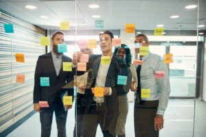 Leadership team at a high-growth technology company planning recruiting strategy for 2026 in a modern conference room.