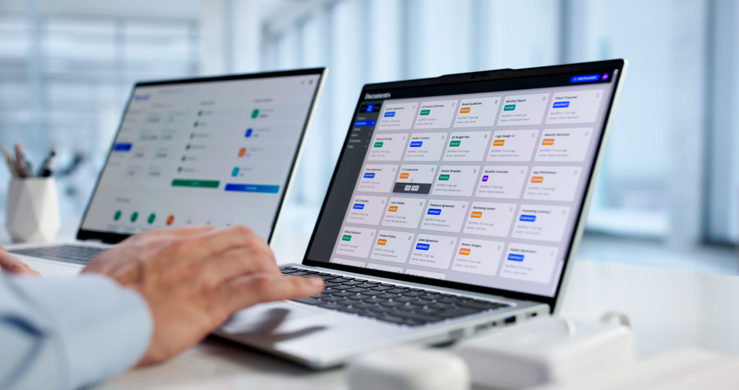 Business leader reviewing integrated HR technology systems, including applicant tracking and workforce management software, in a modern office environment.