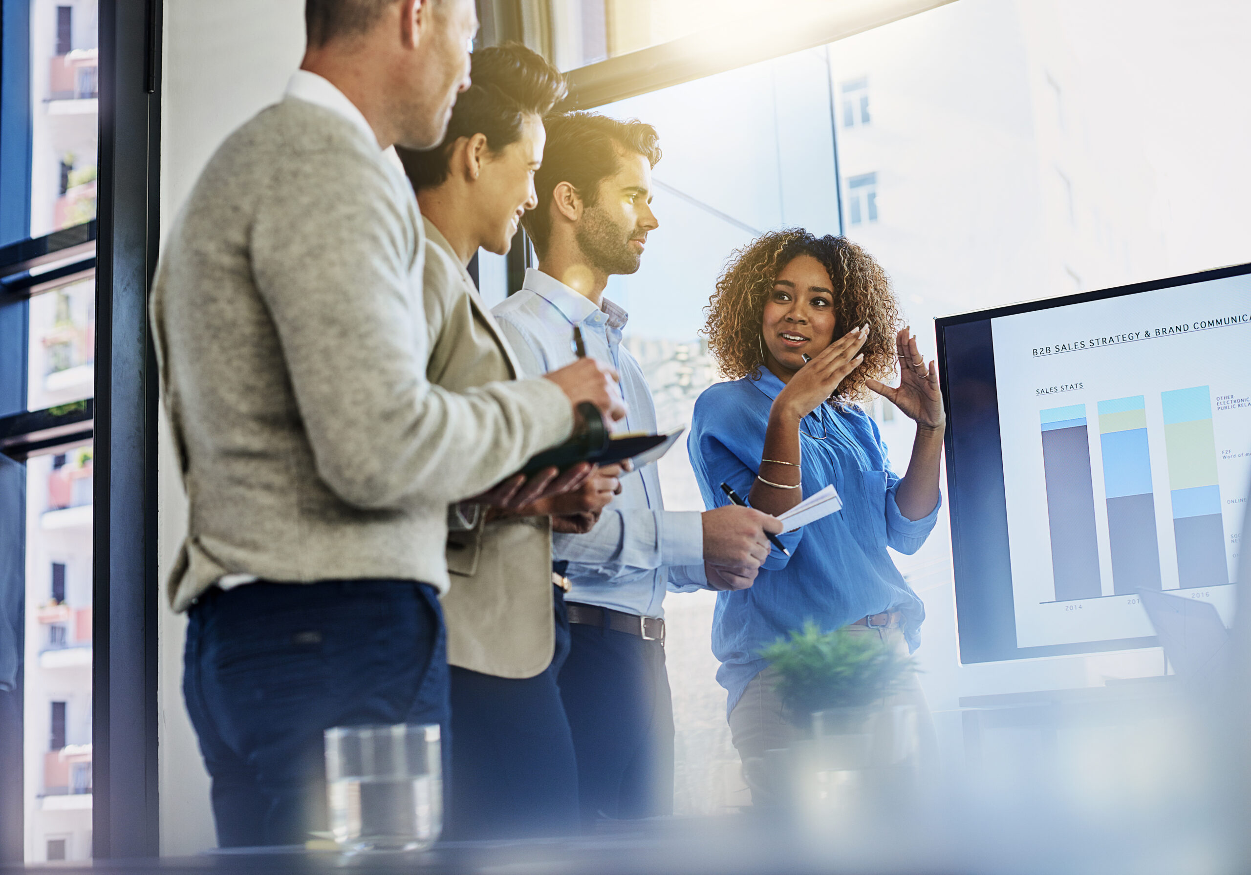 Business professionals collaborating across different departments and functions