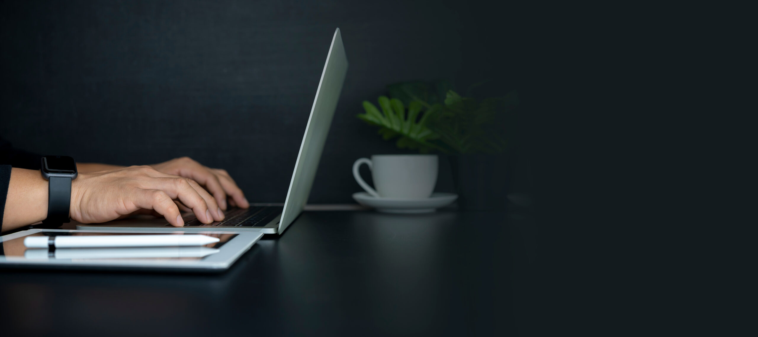 Recruiter typing a personalized outreach email to a passive candidate on a laptop